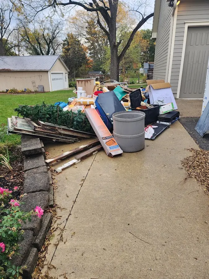 Dumpster being loaded with debris for Residential Dumpster Rental in Rensselaer